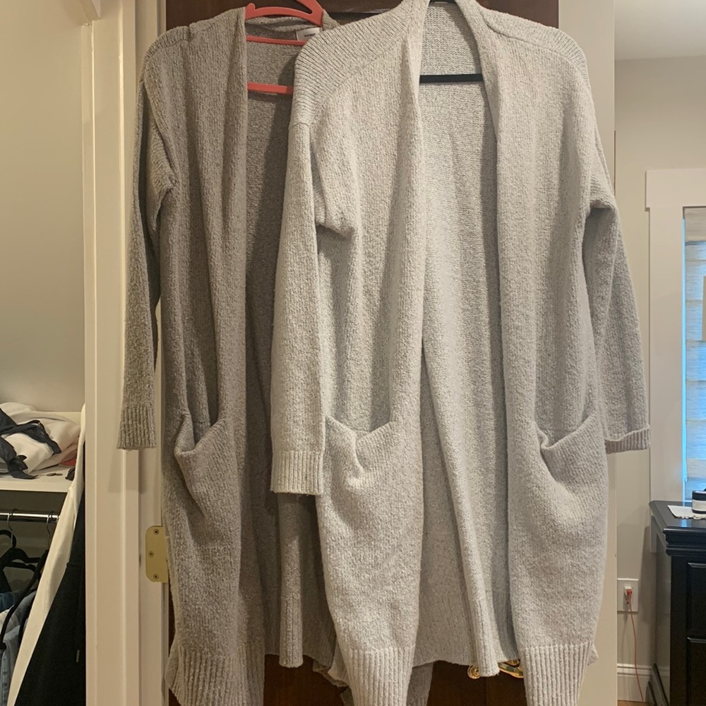 Two grey long sweaters